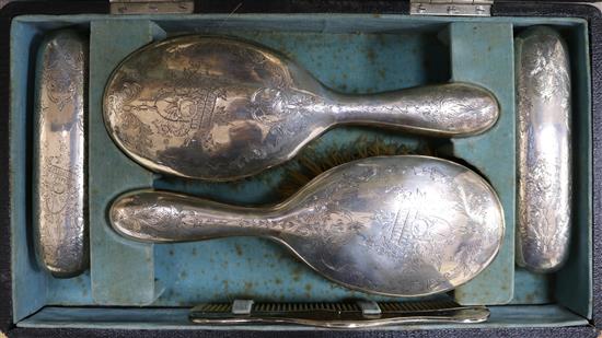 A cased Edwardian silver six piece dressing table set.